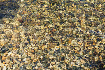 Colorful stones under water. Abstract background.