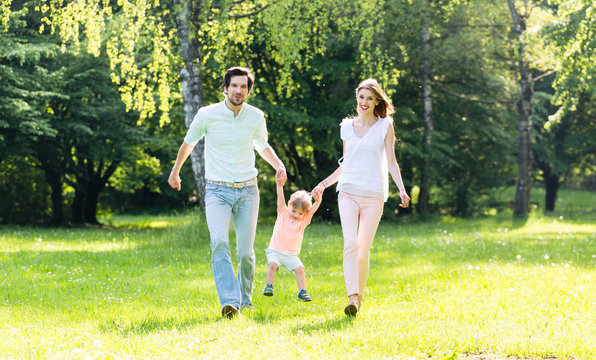 Family having walk together in summer