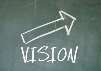 vision arrow sign on blackboard