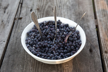 Plate of blueberries and three spoons