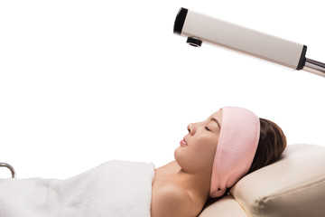 Beauty treatment of face skin with ozone facial steamer in spa center , asian women facing the steam. Steam for smooth skin, isolated on white with clipping path - obrazy, fototapety, plakaty