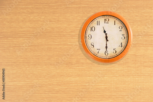“Clock showing 11:30 o’clock on a wooden wall” Stock photo and royalty