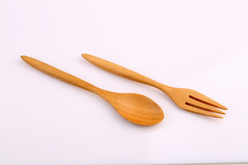Wooden fork and wooden spoon made by Teak isolated on white back