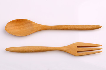 Wooden fork and wooden spoon made by Teak isolated on white back