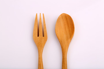 Wooden fork and wooden spoon made by Teak isolated on white back