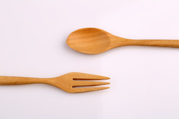 Wooden fork and wooden spoon made by Teak isolated on white back