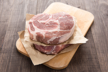 Raw fresh meat steak on wooden background