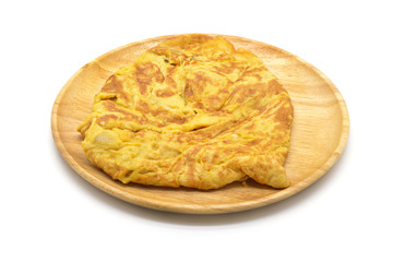 Isolated close up omelet on wooden dish