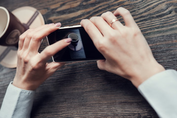 Woman hands with touch screen smartphone