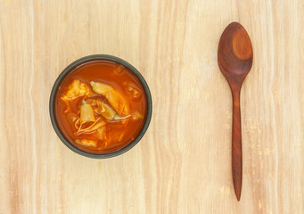 Spicy sour soup vegetable on wooden background