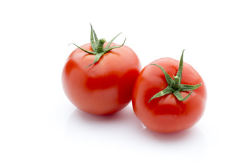 Tomato on the white isolatd background.