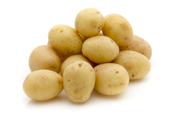 Potatoes on the white background.  New harvest.