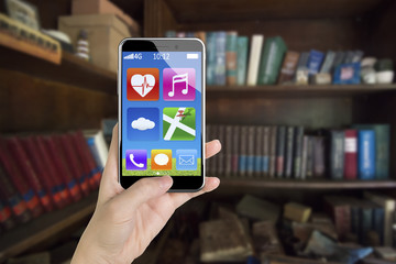 Female hand holding app icons smartphone with thumb pushing butt