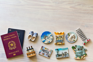 various passports and souvenir magnets from several world country