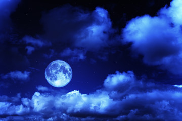 Naklejka na ściany i meble Night sky with a full moon and shining stars