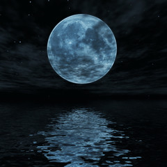 Big blue moon reflected in water surface