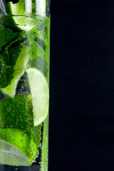 Mojito cocktail on the dark background