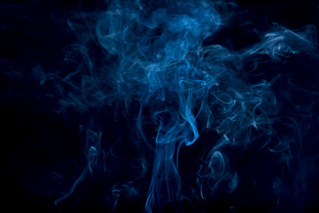 Movement of white smoke on black background