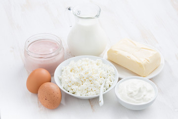 fresh dairy products on white wooden table