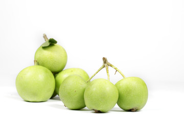 Several small green apples isolated on white, noncommercial variety