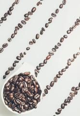 Coffee beans pattern with a coffee cup on top