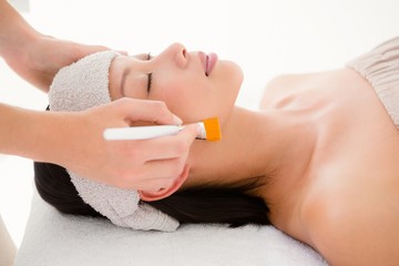 Obraz na płótnie Canvas Attractive woman receiving massage at spa center