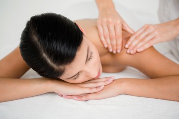 Obraz na płótnie Canvas Pretty brunette enjoying a massage
