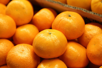 close up of fresh mandarin oranges on market