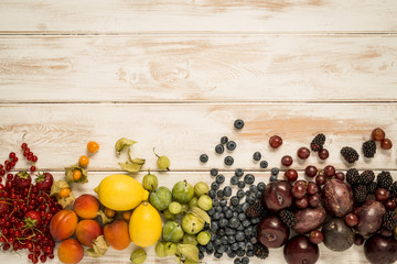 Fruit rainbow on wood