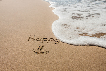 DRAWING ON THE SANDY BEACH