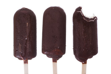 chocolate ice cream, a piece bitten off, part eaten