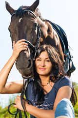 Fototapeta na wymiar Portrait of a beautiful woman in a horse.