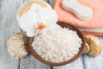 Spa salon with sea salt, towels and flowers