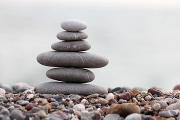 pile of balanced round stones on the beach