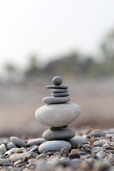  pile of balanced round stones on the beach