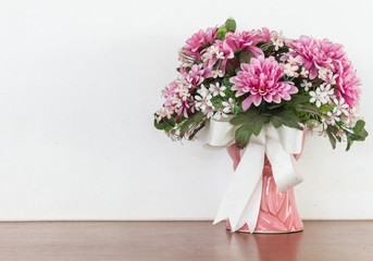 Still life with flowers on wooden table