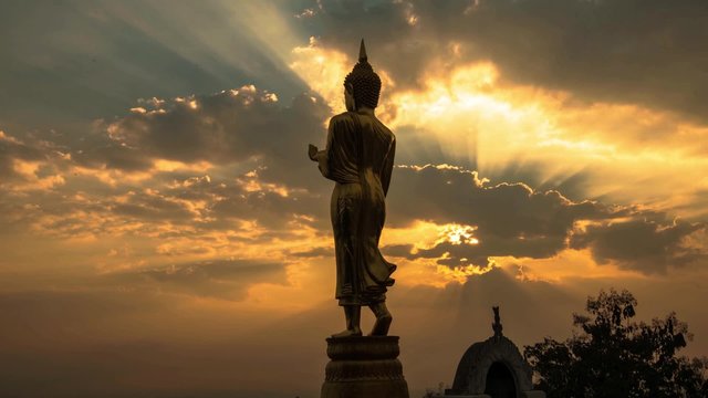 HD Timelapse sunrise with golden buddha at Wat Phra That Kao Noi, that built during the 23rd-25th Buddhist centuries. Nan, THAILAND.