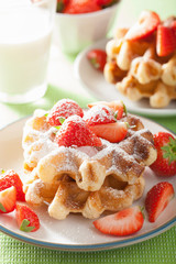 belgian waffles with icing sugar and strawberry