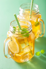 ice tea with lemon and melissa in mason jars