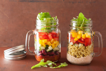 Fototapeta na wymiar vegan quinoa vegetable salad in mason jars