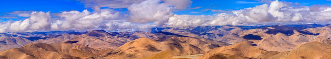 Naklejka na ściany i meble Mountain with clouds sky in Tibet