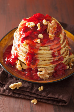 pancakes with strawberry jam and walnuts. tasty dessert