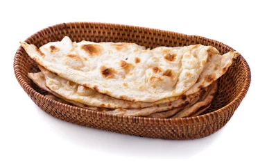 Poster stack of indian naan bread in small basket © Odua Images