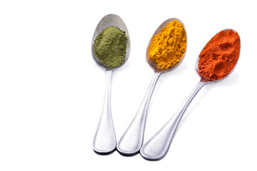 some of indian spices on spoons