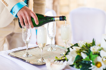 Banquet event. Man pouring champagne 