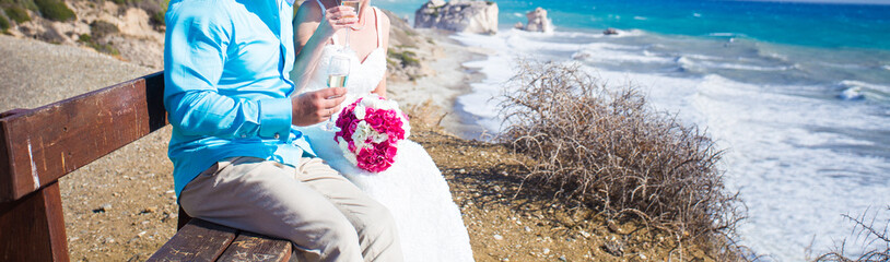 Bride and groom by the sea 