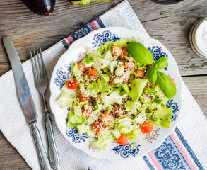 Fresh vegetable salad with tomato, eggplant, sesame seeds and fl