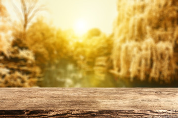 wooden table and autumn day 