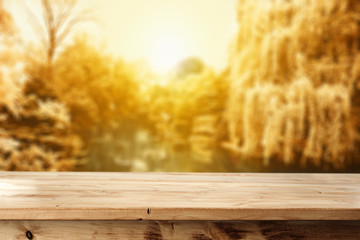 wooden table and autumn day 