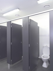 Row of toilet cubicles in a pristine industrial lavatory, Melbourne, Australia 2015